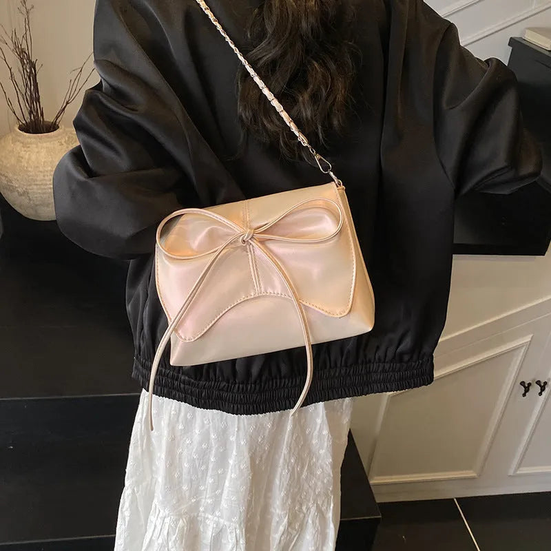 Women's underarm crossbody bag in horizontal square shape with sandwich pocket design and crossbody strap