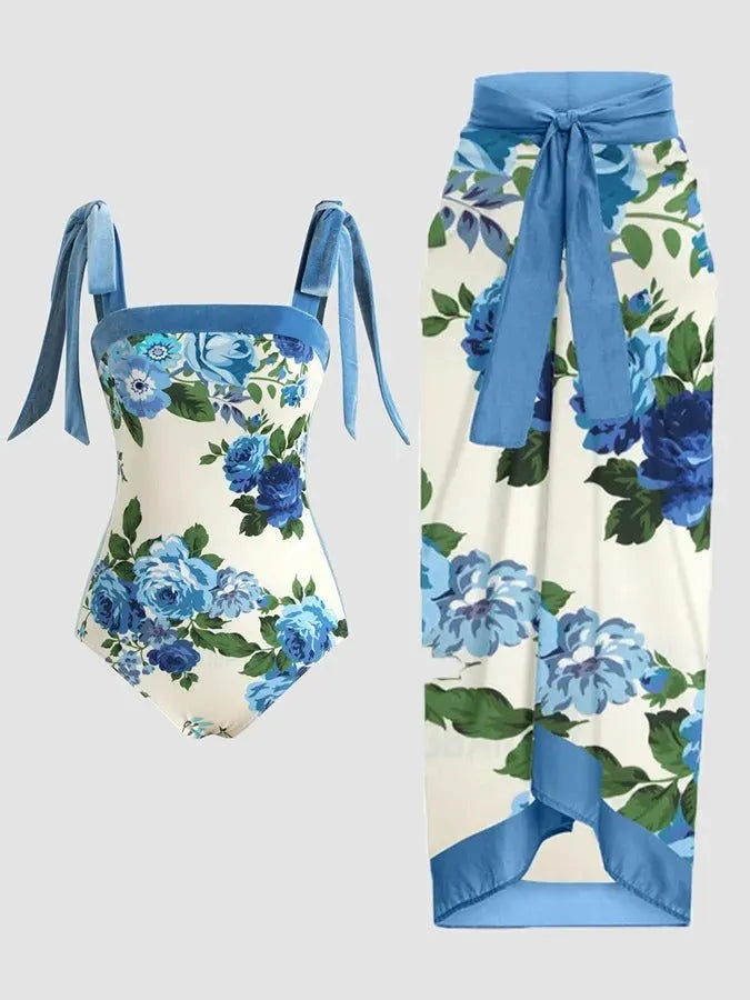 Women's floral print two-piece swimsuit with a sheer chiffon hip skirt, shown in one of the available colour variations.