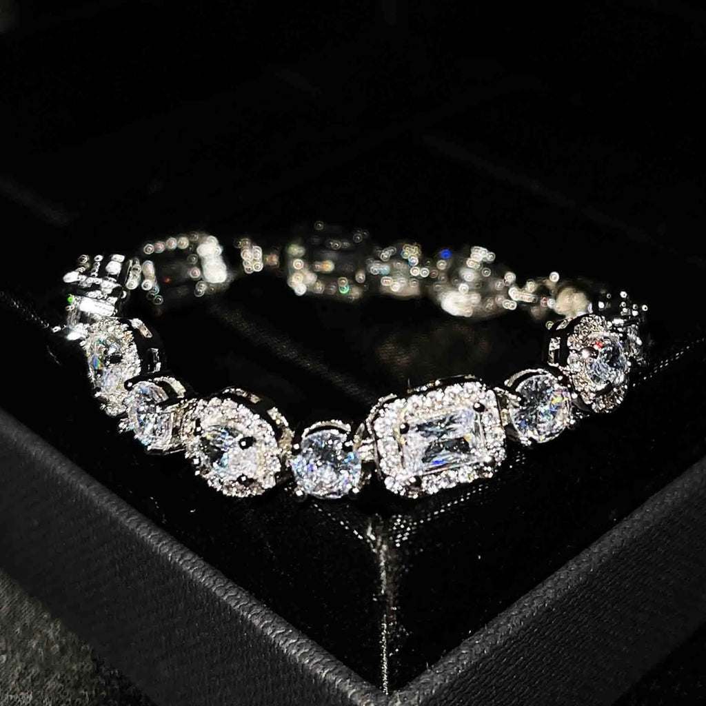 Women's sterling silver-plated bracelet with white gold finish and inlaid zircon stones.