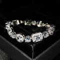 Women's sterling silver-plated bracelet with white gold finish and inlaid zircon stones.