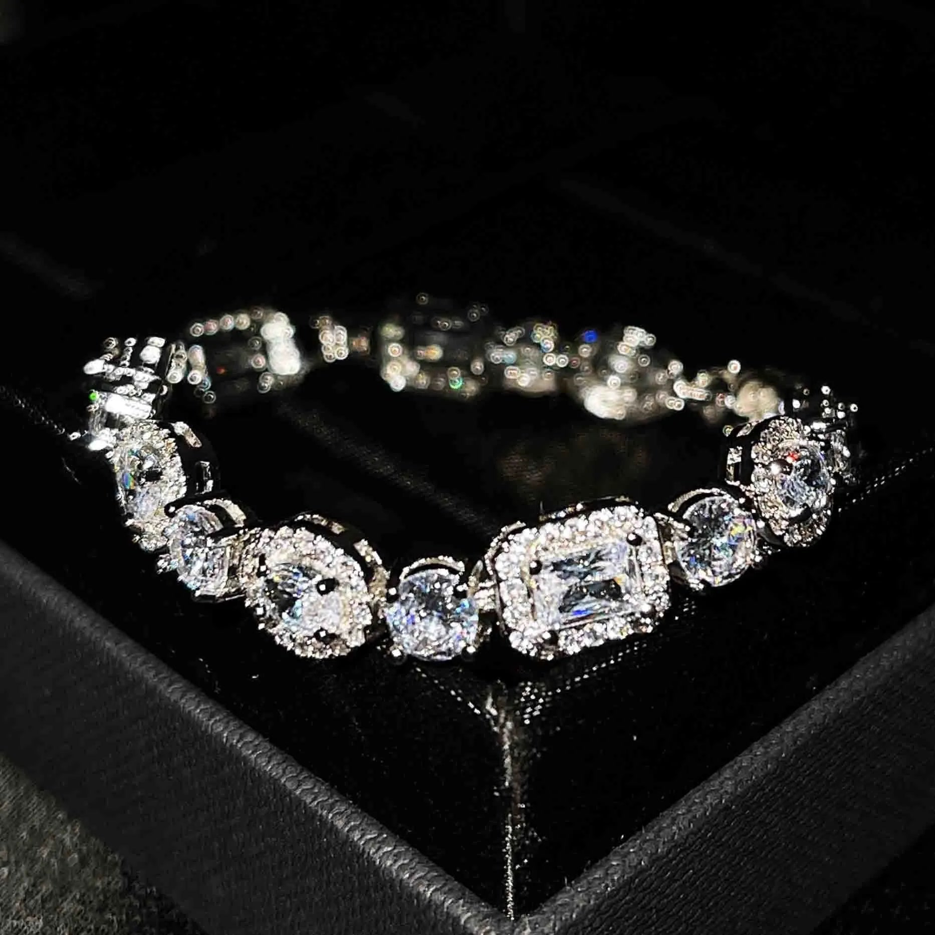 Women's sterling silver-plated bracelet with white gold finish and inlaid zircon stones.