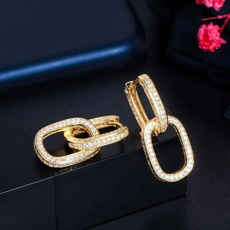 Pair of copper earrings with inlaid zircon, U-shaped geometric buckle design in white gold colour
