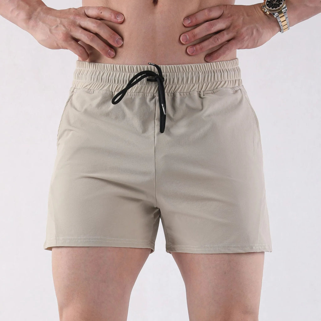 Men's thin polyester basketball shorts in apricot colour with elastic waistband.