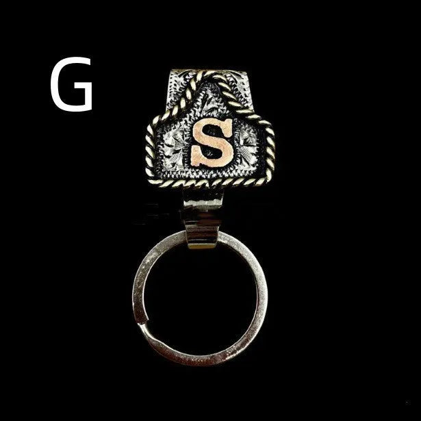 Handmade metal cow tag belt keychain in a selected colour from the A-Z letter range.