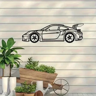 Black iron sports car wall art decoration on a white wall