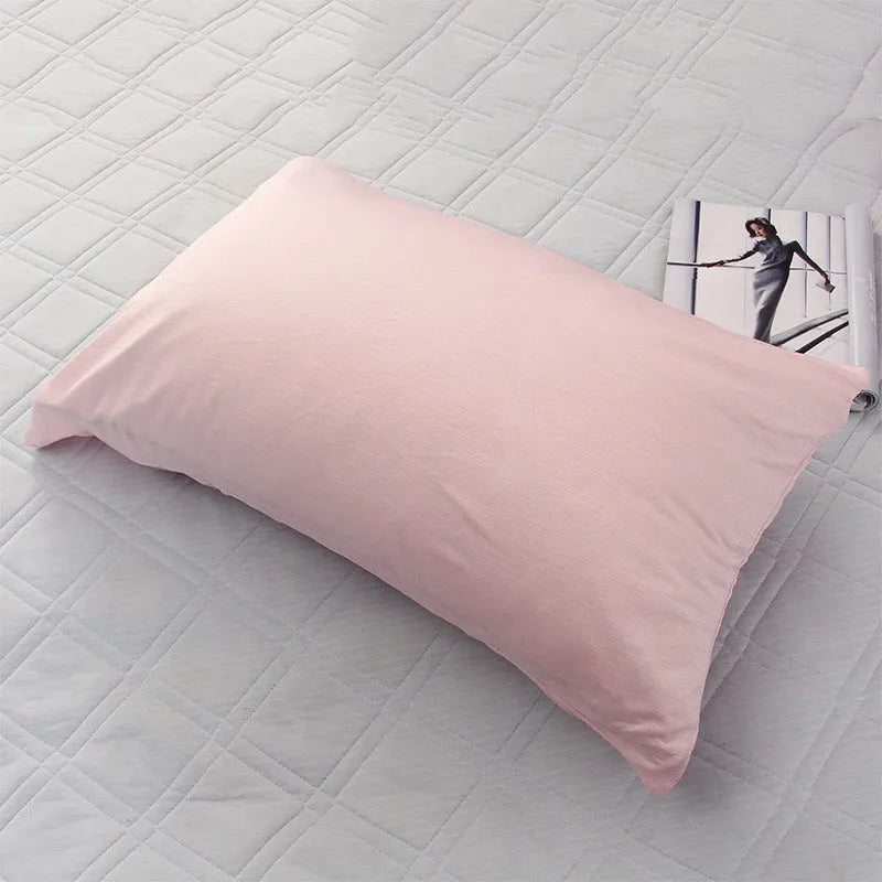 A blue polyester cooling blanket with Q-Max 0.4 technology laid on a bed.