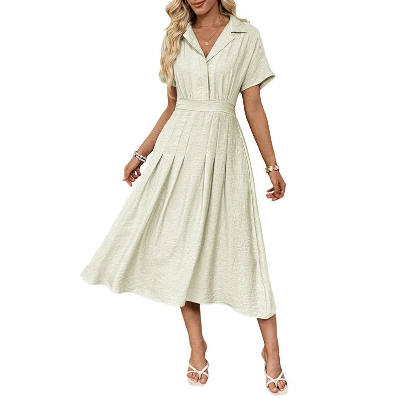 Light green twill shirtdress with lapel collar, waist-tight skirt, and commuter pocket design