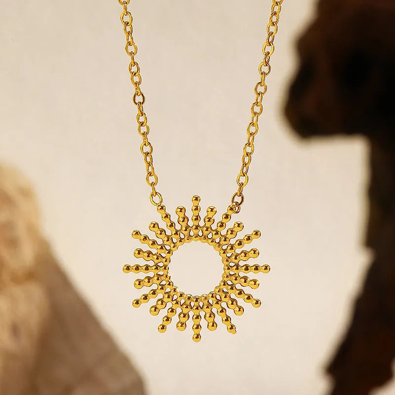 Gold geometric necklace and bracelet jewellery set with chain elements and Y-shaped pendant