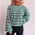 Women's striped loose pullover sweater in polyester knit with round neck and long sleeves