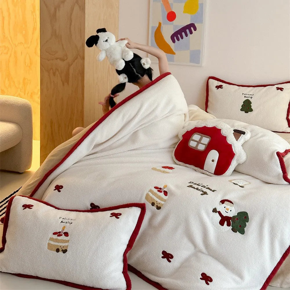 Winter Christmas cartoon bedding four-piece set with snowman and heart pattern on duvet cover and pillowcases.