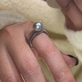 Geometric open copper ring for women with a black pearl on an adjustable band.