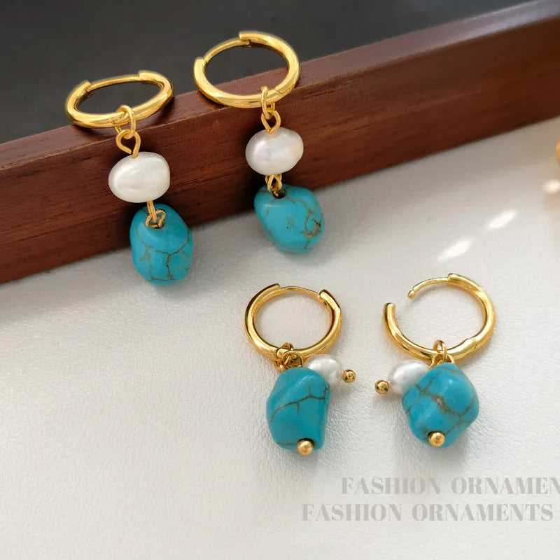 A pair of short and a pair of dangle geometric turquoise copper earrings.