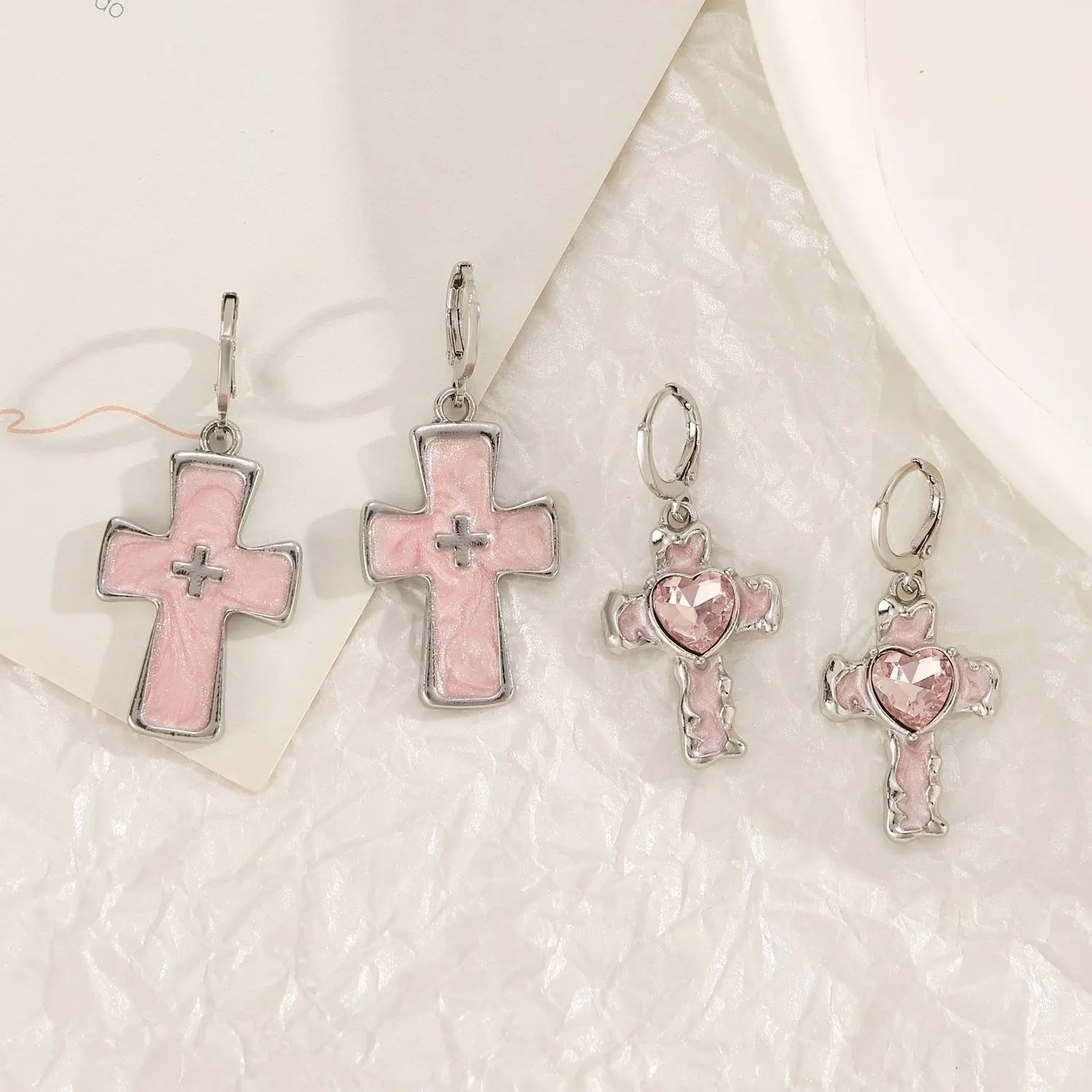 Women's cross crystal earrings in alloy with five colour options showing drip oil finish and geometric designs
