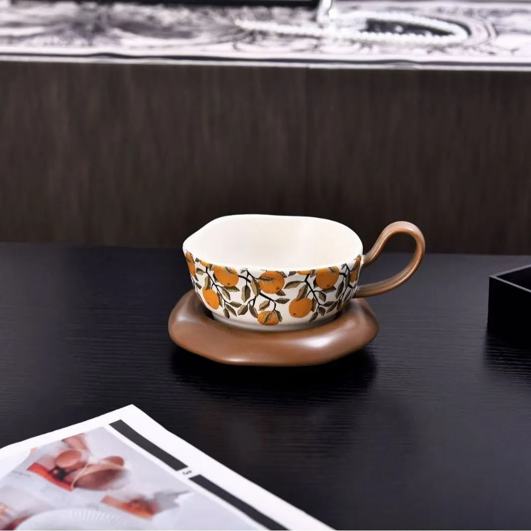 Retro antique style ceramic coffee cup and saucer set in black or orange with 210ml capacity.
