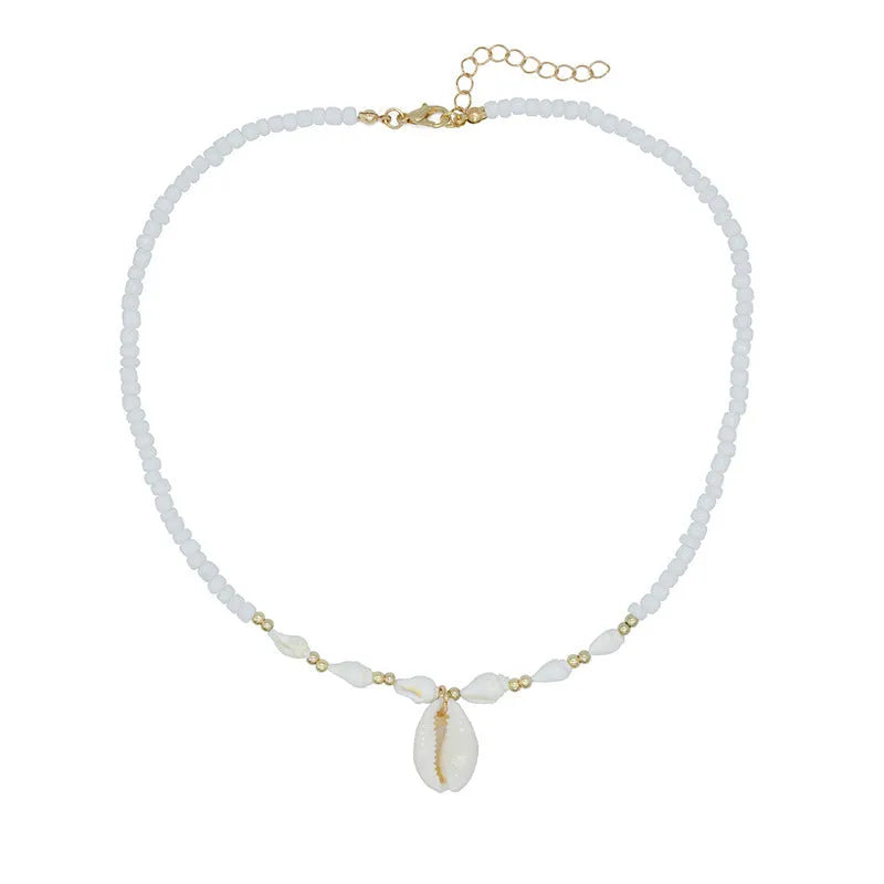 White conch shell bead necklace with mother of pearl pendant on a silver-toned electroplated chain.
