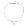 White conch shell bead necklace with mother of pearl pendant on a silver-toned electroplated chain.