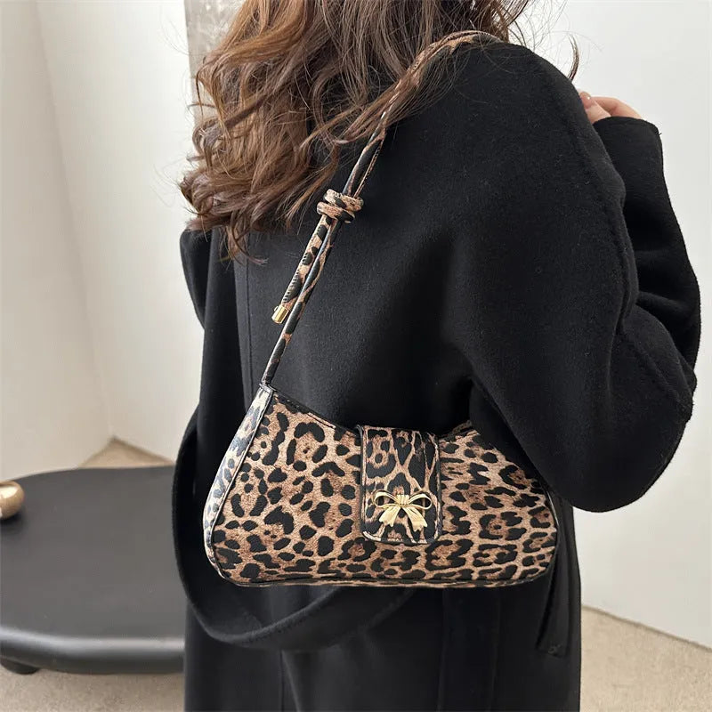 Women's casual handbag in black PU leather with sandwich pocket design measuring 27x13.5x6cm