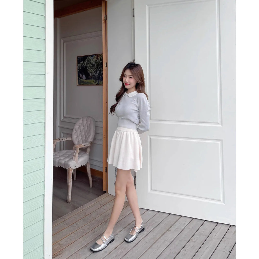 Women's silver genuine leather Mary Jane shoes with a cross buckle strap and low flat heel.