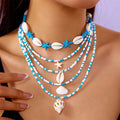 Five multi-layer beaded necklaces with starfish and shell charms in blue and colours