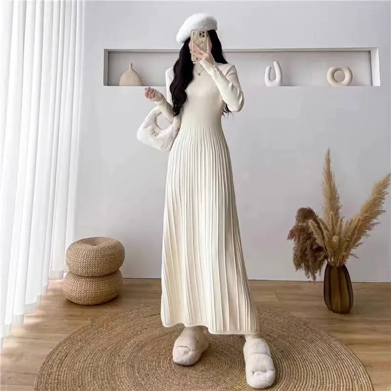 Women's knitted high waist A-line skirt dress in a solid colour, mid-length below the knees
