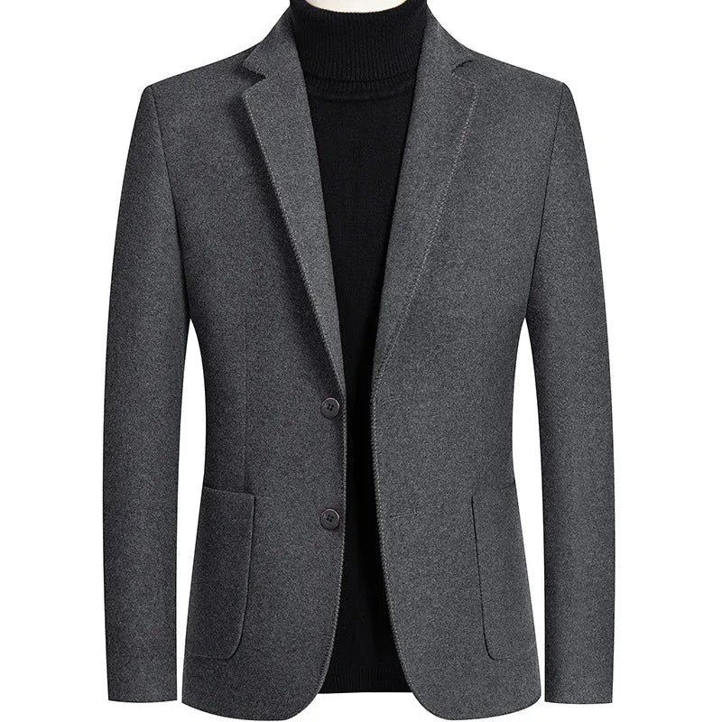 Men's slim fit wool suit jacket in grey shown on a model, suitable for autumn and winter wear.