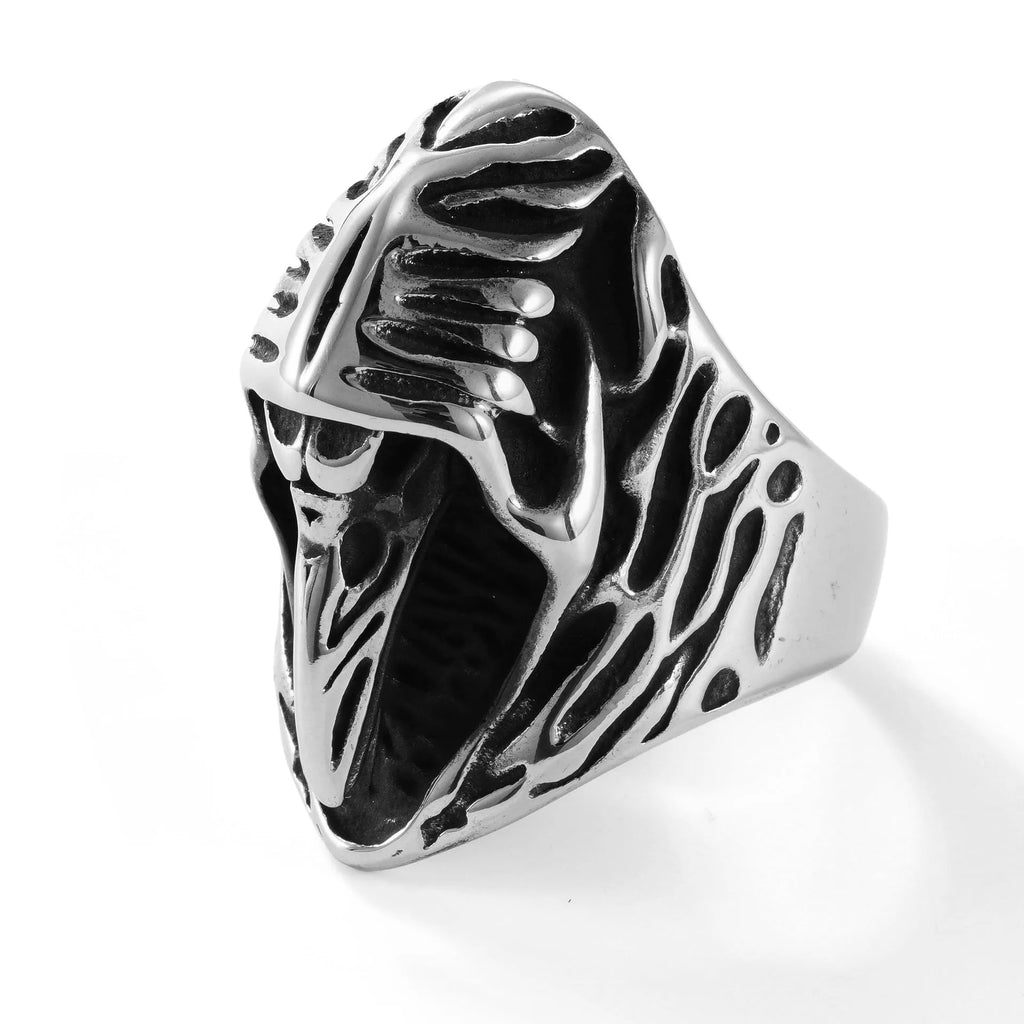 Geometric titanium steel crow ring in a punk retro style on a grey background.