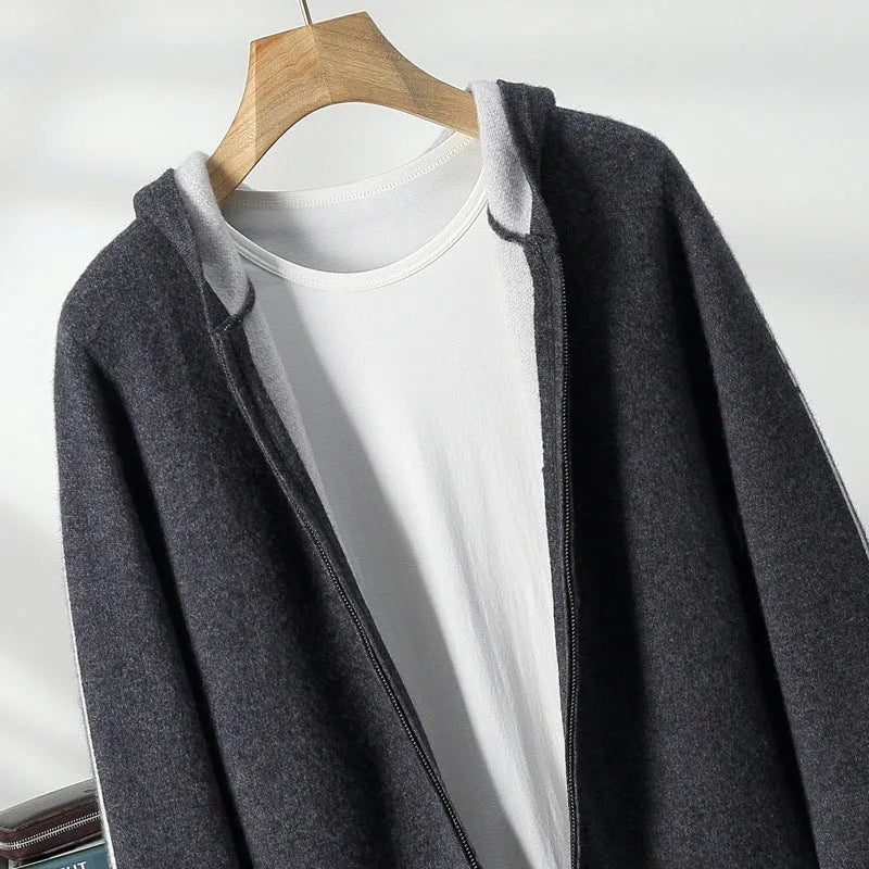 Man wearing a dark blue loose fit cashmere wool cardigan with a half-high zipper collar