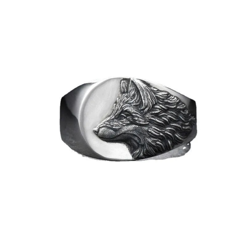 Men's silver geometric wolf head alloy ring on a grey background.