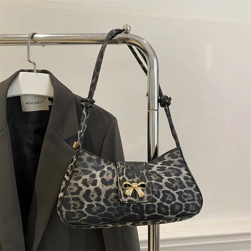 Women's casual handbag in black PU leather with sandwich pocket design measuring 27x13.5x6cm