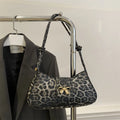 Women's casual handbag in black PU leather with sandwich pocket design measuring 27x13.5x6cm