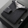 Man wearing a dark blue loose fit cashmere wool cardigan with a half-high zipper collar