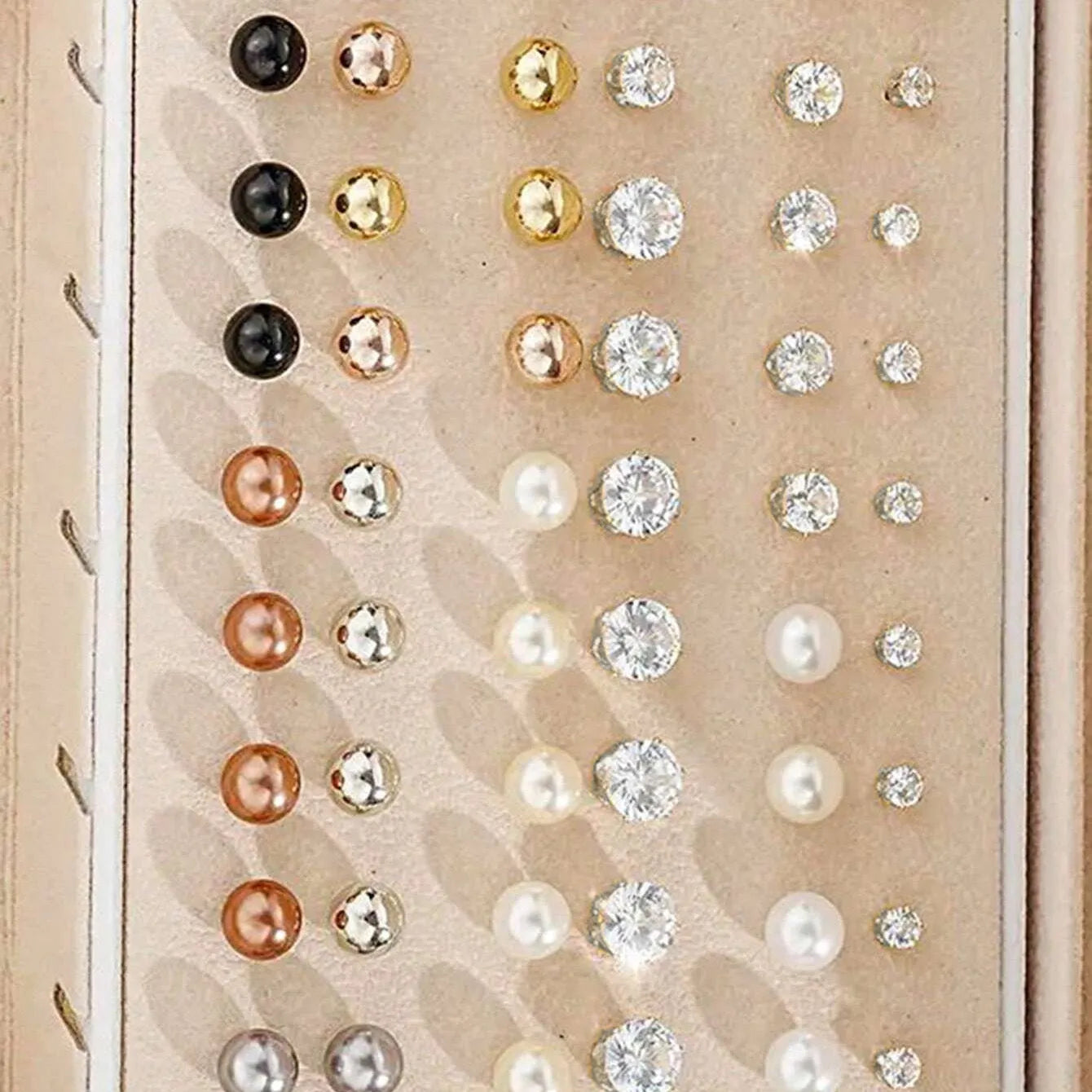 108 geometric alloy earrings with electroplated gold and yellow finishes showing round design elements