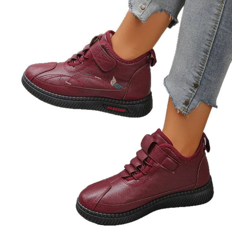 Women's black velvet shoes with non-slip rubber sole and hollow-out pattern.