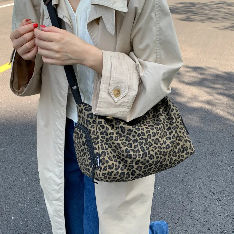 Leopard print sports messenger crossbody bag with large capacity and cloth construction