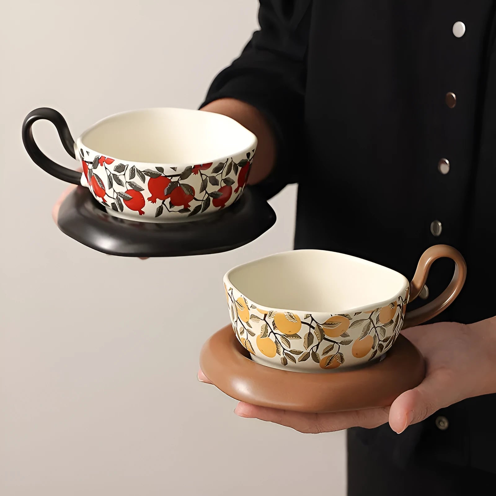 Retro antique style ceramic coffee cup and saucer set in black or orange with 210ml capacity.