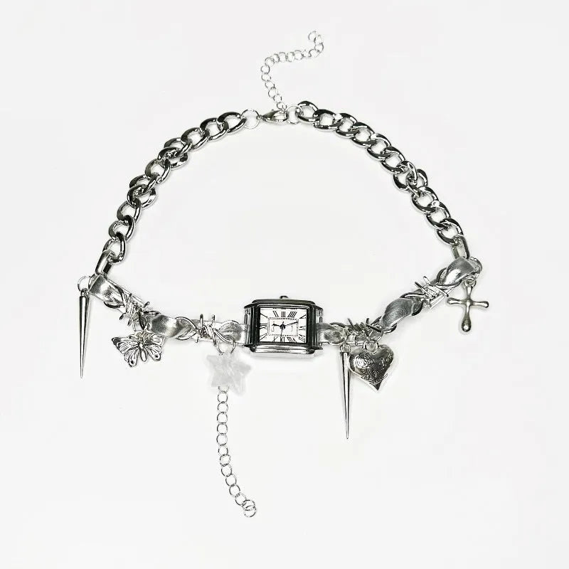 Dark electroplated multi-layer cross necklace with twin clavicle chains on display