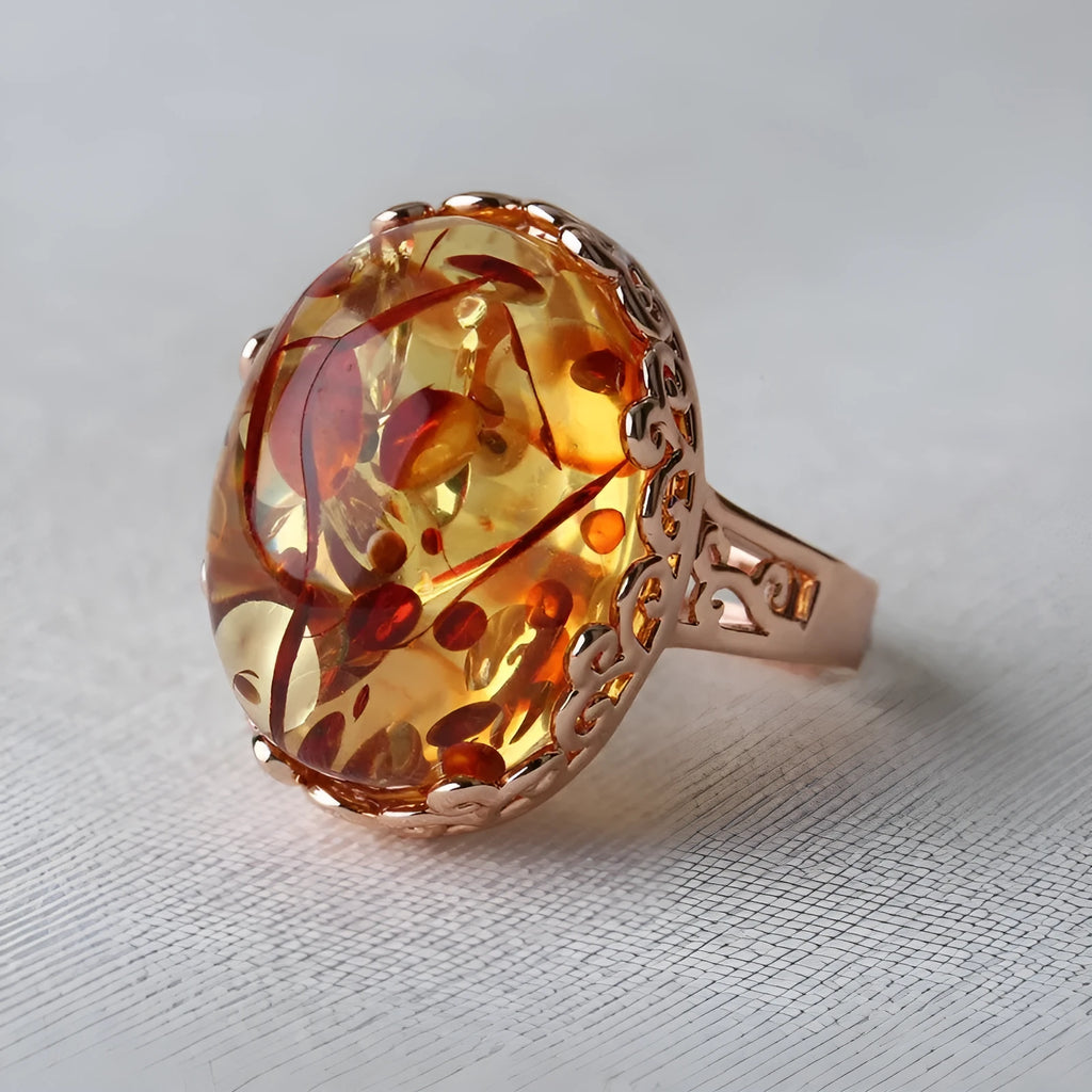 Genuine amber beeswax ring with ethnic style details in New Amber Type A colour on alloy band