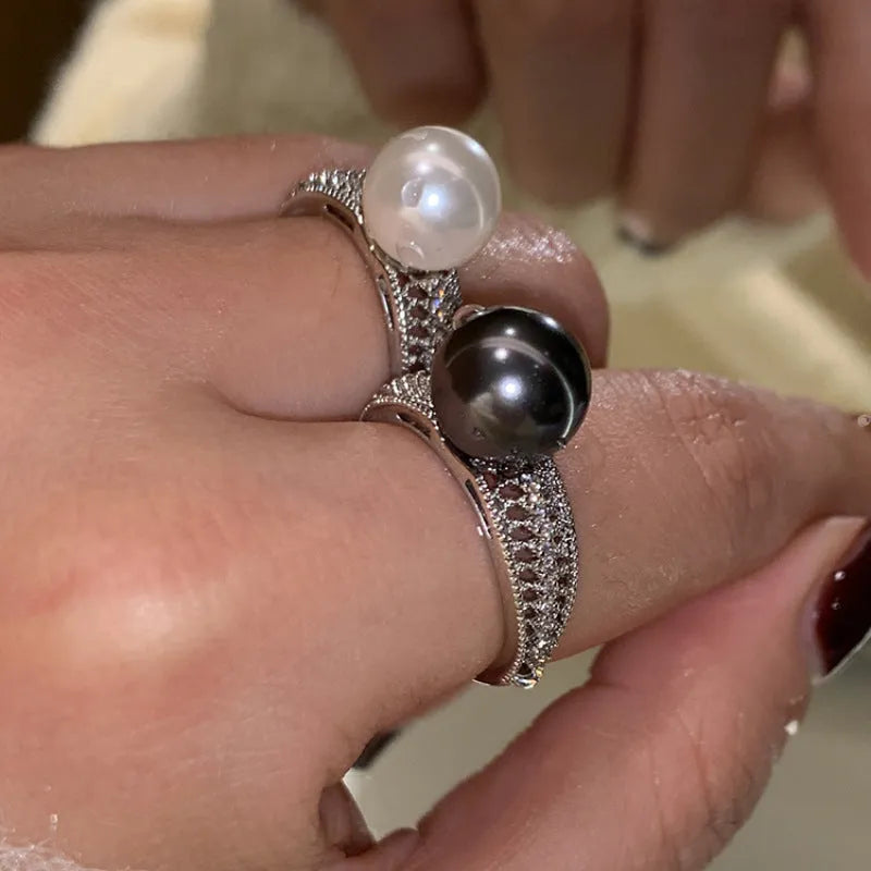 Geometric open copper ring for women with a black pearl on an adjustable band.