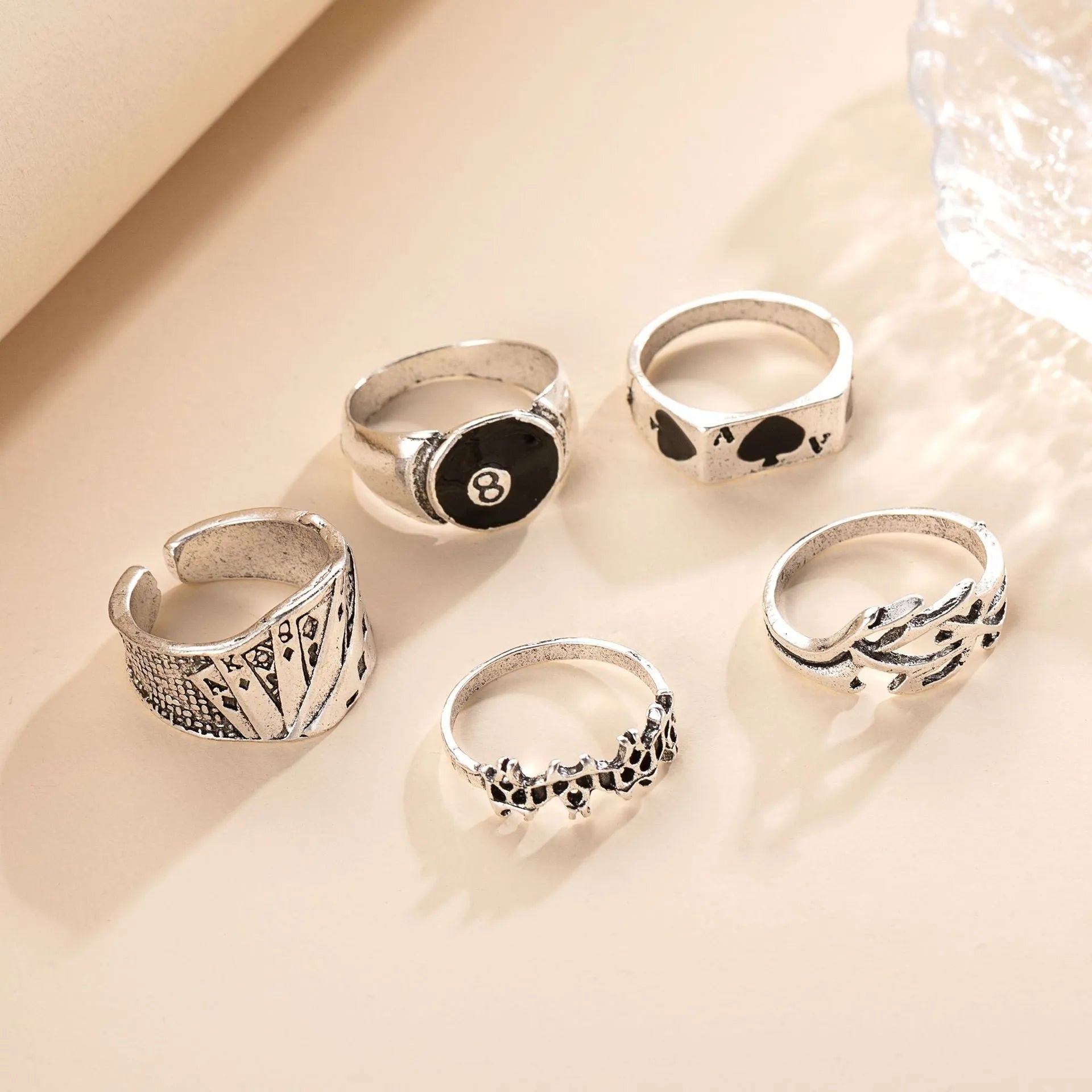 Close-up of a black zinc alloy ring with a detailed retro spade charm on an adjustable band.
