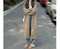 Loose thick chenille cardigan for women in a dark grey colour, showing 3D pattern and mid-length fit.