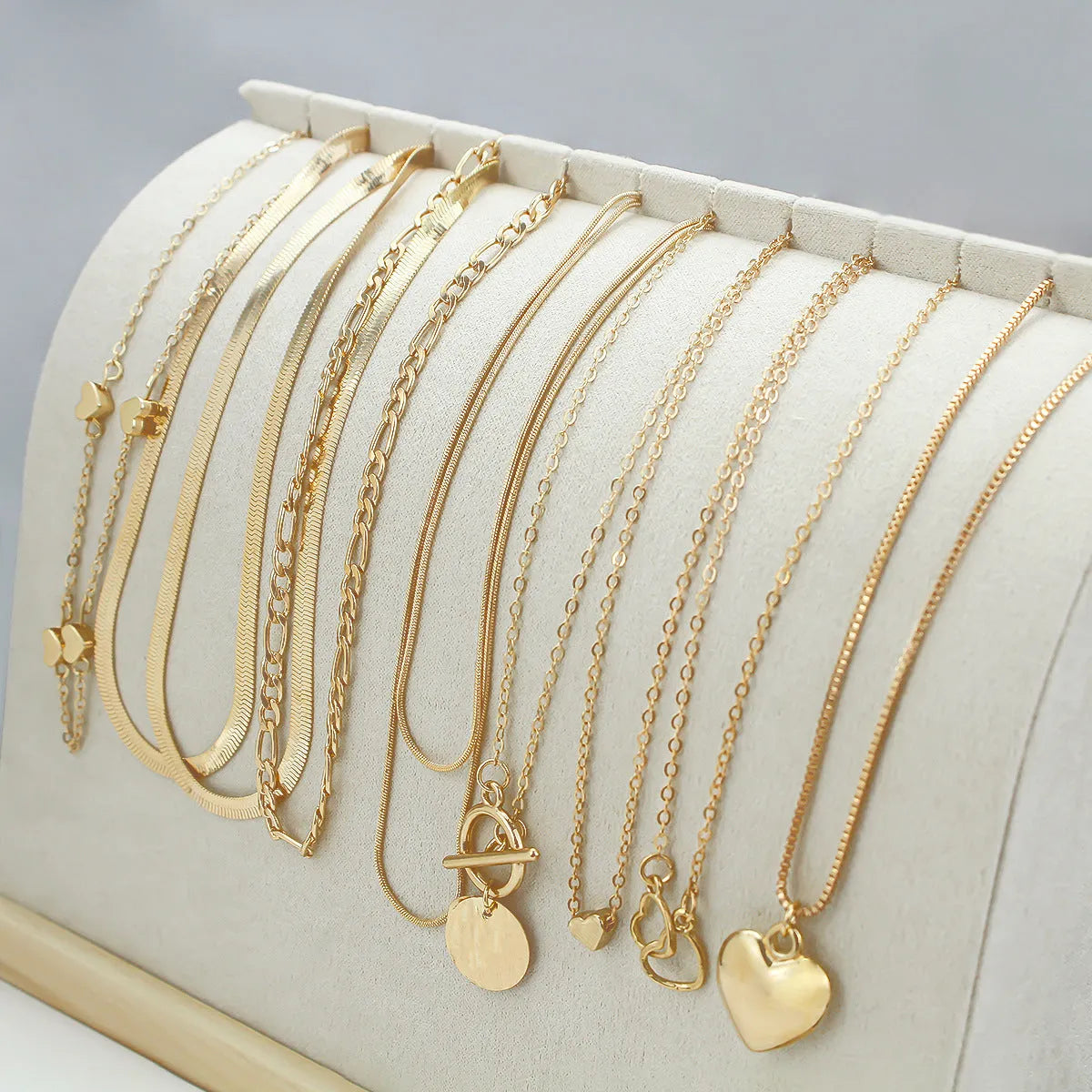 Women's gold electroplated necklace set with ten alloy pendants on adjustable snake bones chain