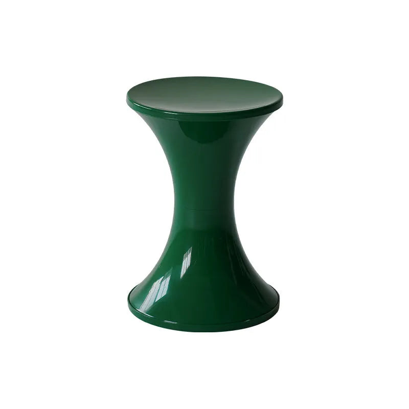Green hourglass-shaped plastic stool for changing shoes, suitable for children and adults.