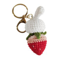 White hand-woven wire pendant with cartoon rabbit strawberry design and attached metal key