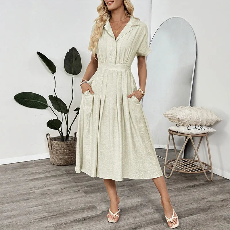 Light green twill shirtdress with lapel collar, waist-tight skirt, and commuter pocket design