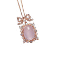 Geometric rose quartz crystal pendant on a silver chain with rose gold plating