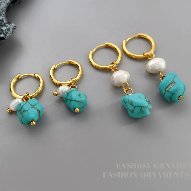 A pair of short and a pair of dangle geometric turquoise copper earrings.
