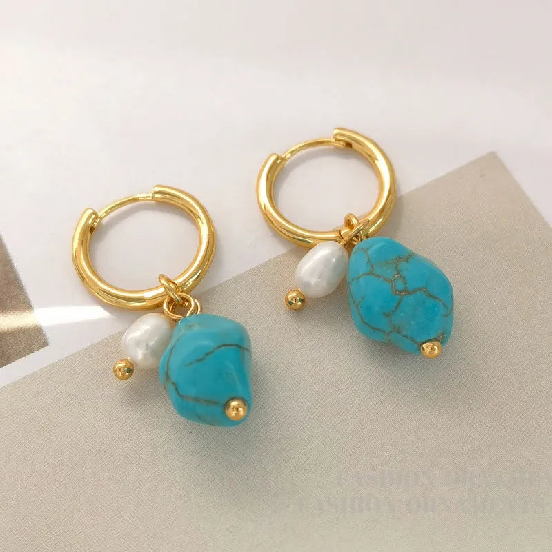 A pair of short and a pair of dangle geometric turquoise copper earrings.