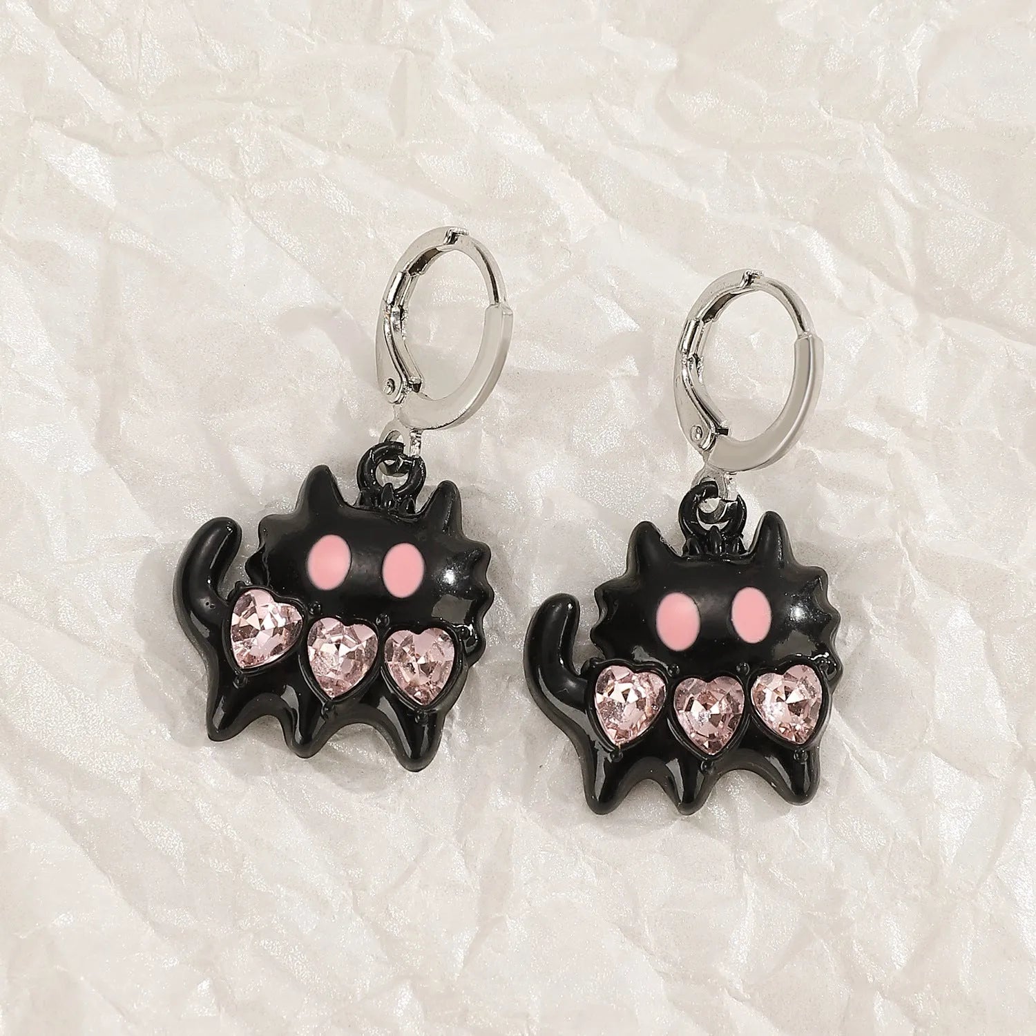 Women's cross crystal earrings in alloy with five colour options showing drip oil finish and geometric designs