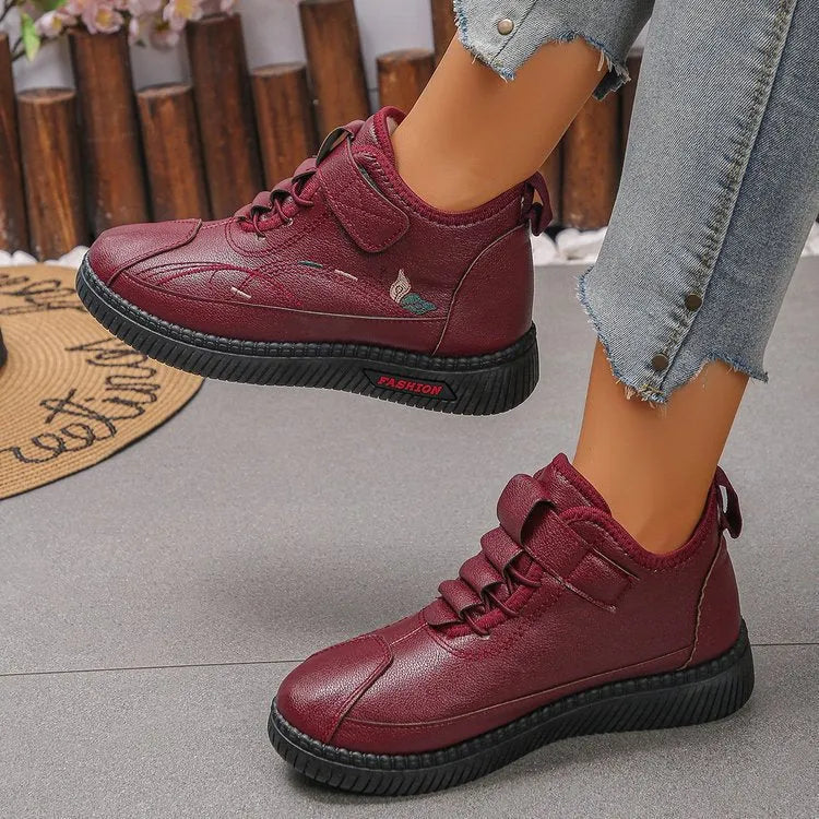 Women's black velvet shoes with non-slip rubber sole and hollow-out pattern.