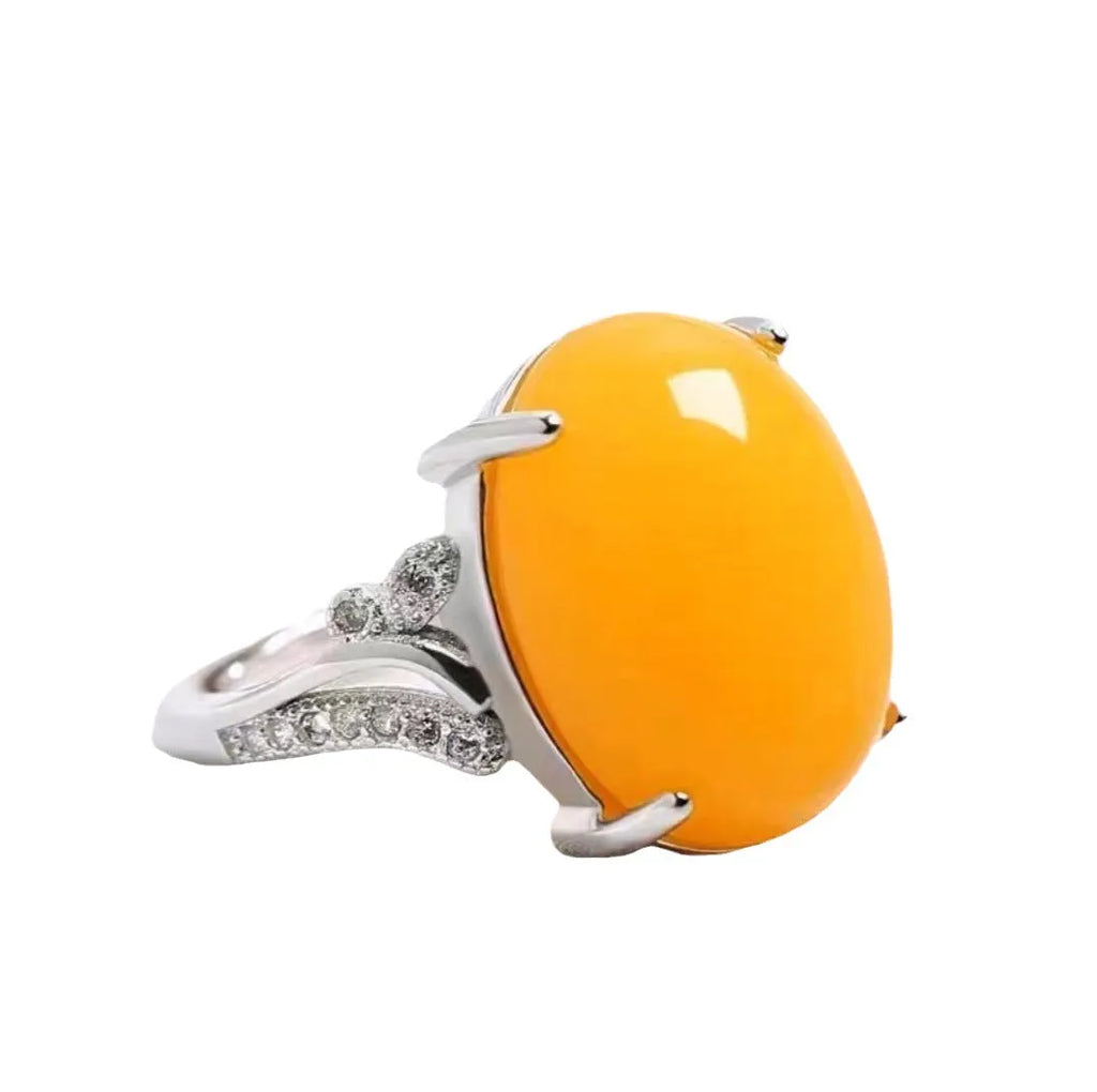 Adjustable geometric ethnic-style alloy ring with a natural sapphire, shown in multiple colour options.